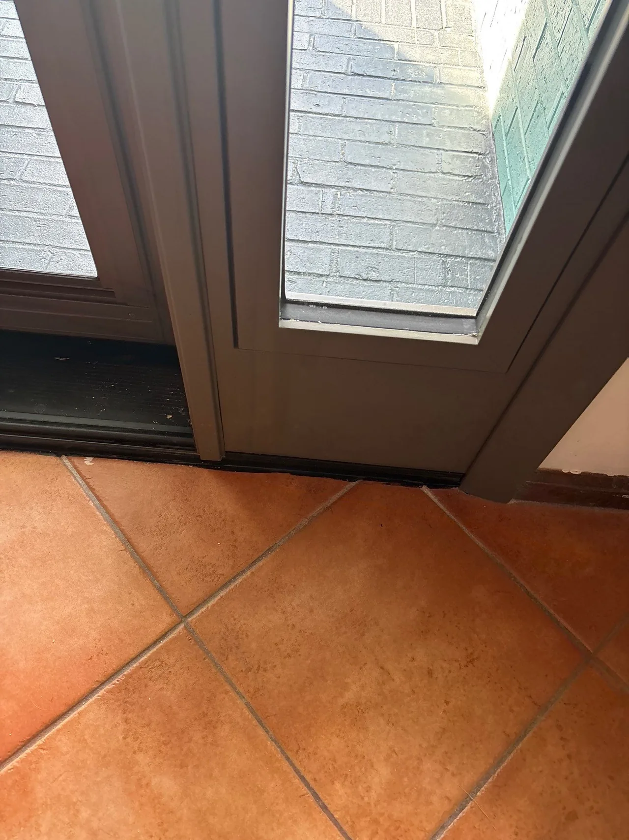 Lower sidelight and the porch beyond during a Myrtle Beach door installation