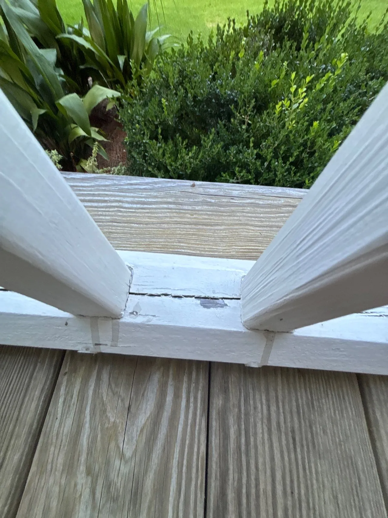 Split paint and wood along the existing lower rail between balusters