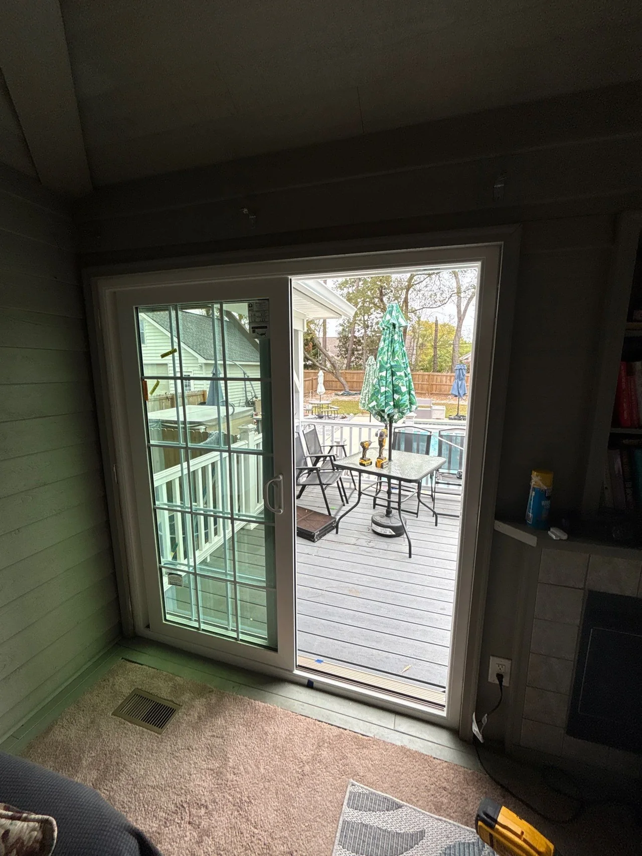 New white sliding patio door open to a Myrtle Beach porch during installation