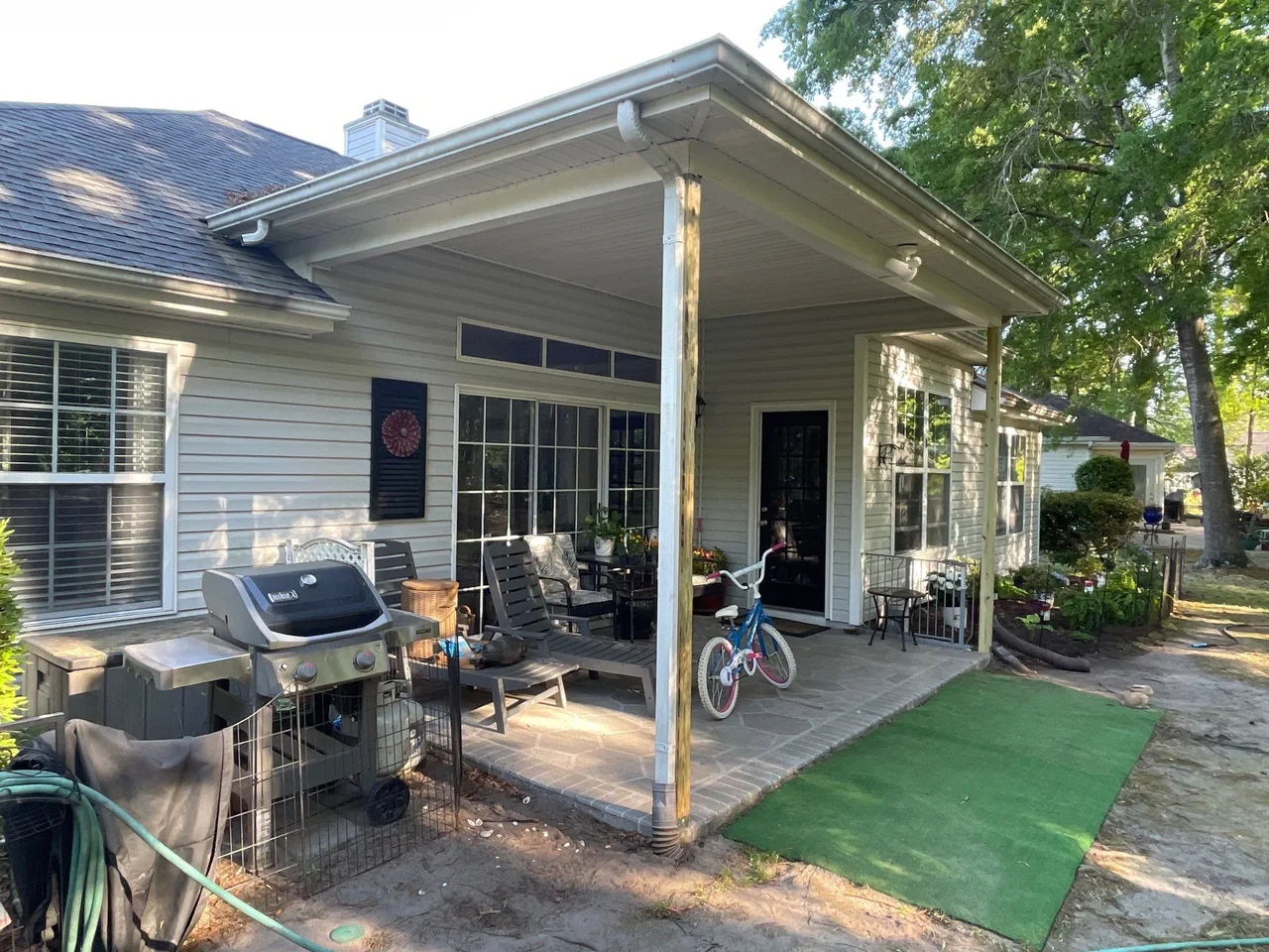 Open covered rear patio before installation of the fixed screen enclosure.